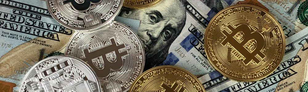 Close-up of bitcoins and US dollar bills symbolizing modern finance and cryptocurrency.